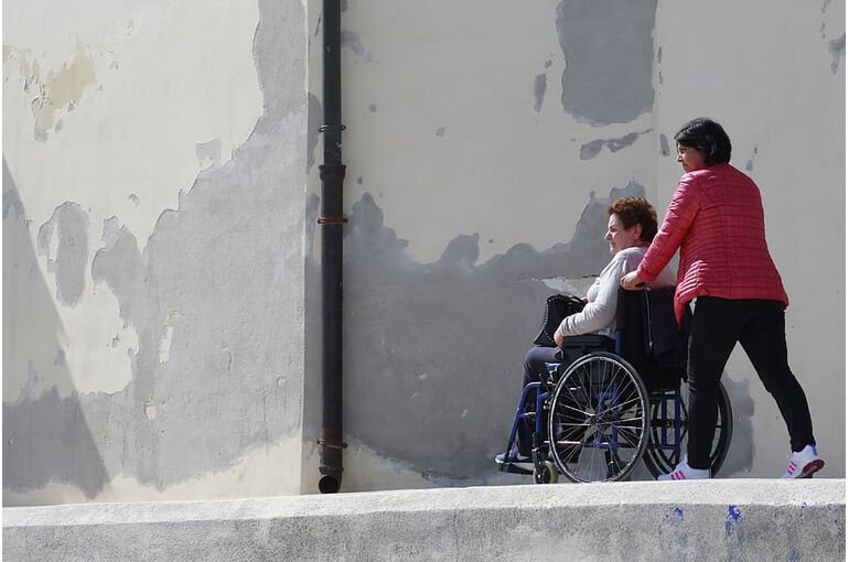 woman-sitting-on-gray-wheelchair